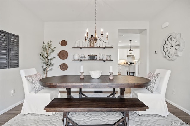 3535 Raintree Ln, Dacono, CO 80514 - dining room with wood finished floors and a chandelier