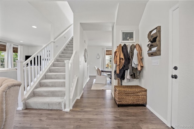 3535 Raintree Ln, Dacono, CO 80514 - foyer entrance with stairway, wood finished floors, and recessed lighting
