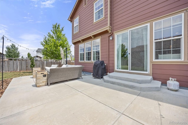 3535 Raintree Ln, Dacono, CO 80514 - fenced backyard with an outdoor living space, a patio, area for grilling, and entry steps