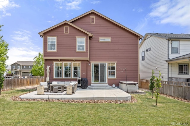 3535 Raintree Ln, Dacono, CO 80514 - back of property with an outdoor living space, a patio, a hot tub, and a fenced backyard