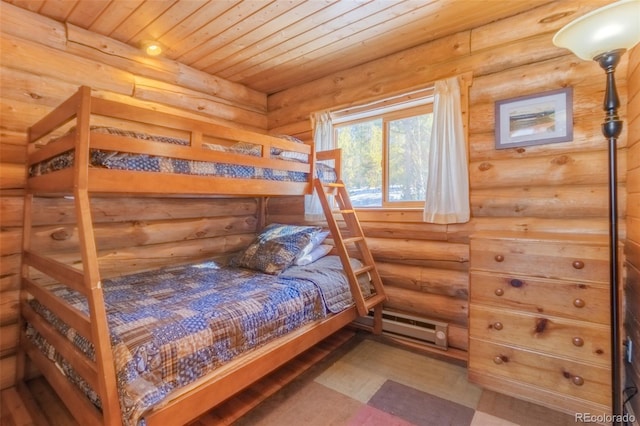 bedroom with a baseboard radiator and wooden ceiling