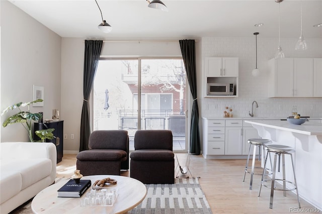 living area with light wood-style floors