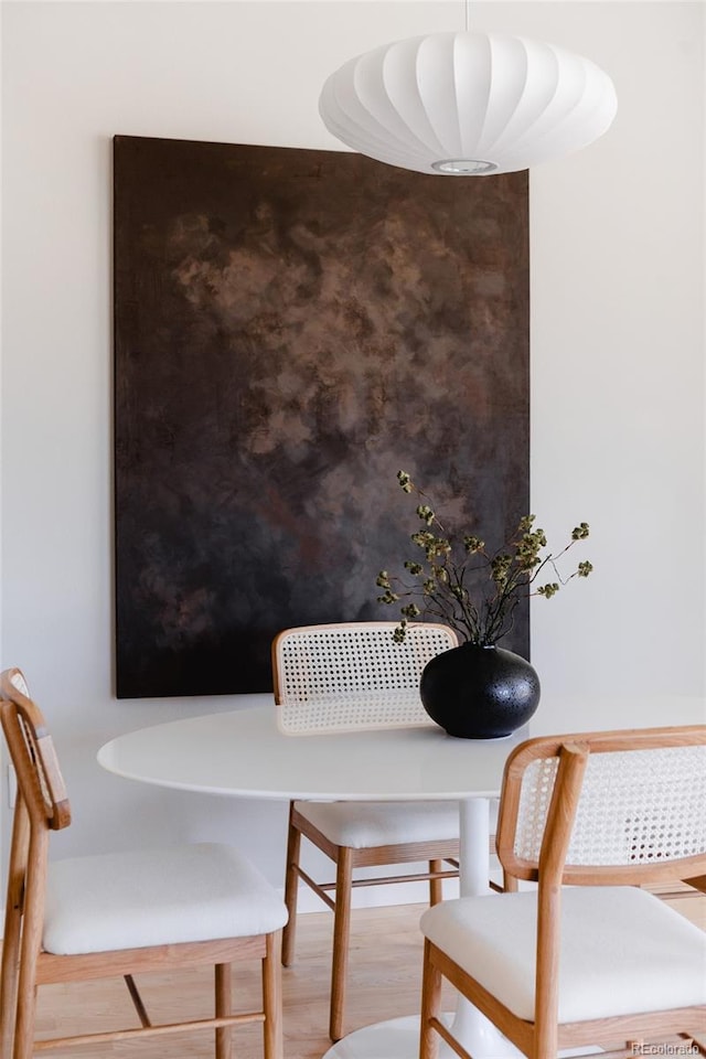 dining space featuring wood finished floors