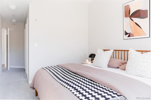 bedroom with carpet and baseboards