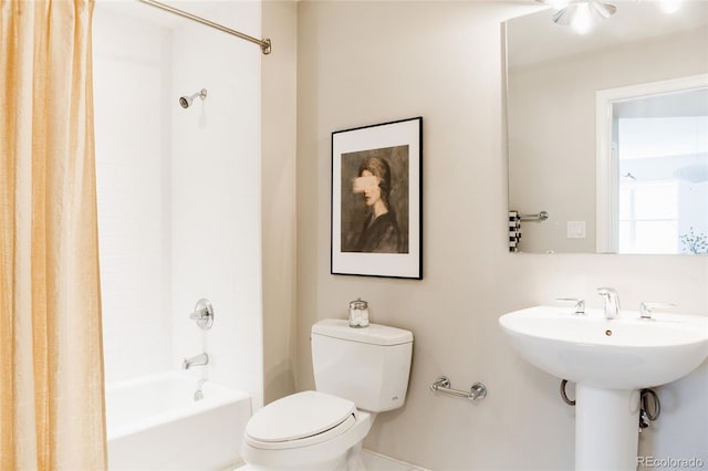 full bathroom featuring shower / tub combo with curtain and toilet