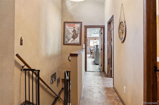 96 County Road 7, Fairplay, CO 80440 - hallway with baseboards, an upstairs landing, and a textured wall