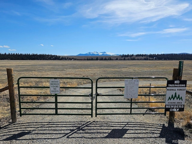 96 County Road 7, Fairplay, CO 80440 - view of gate featuring fence, a mountain view, and a rural view