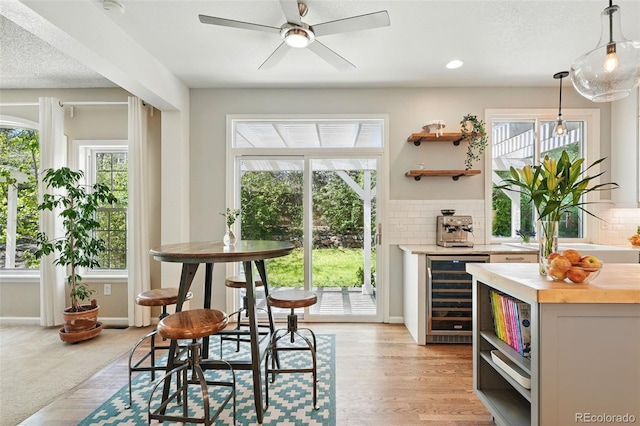 interior space with a wealth of natural light and beverage cooler