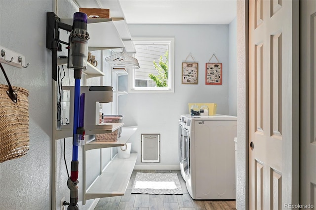 kitchen with separate washer and dryer, wood finished floors, baseboards, and open shelves