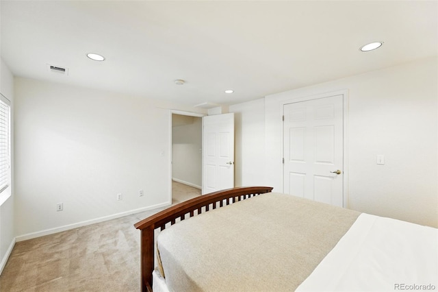 unfurnished bedroom with baseboards, recessed lighting, and light colored carpet