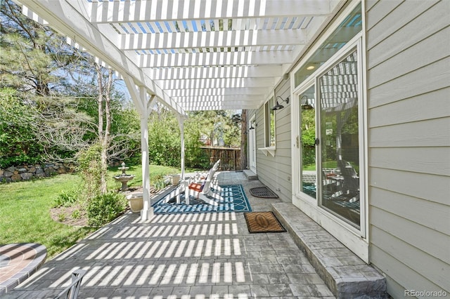 view of patio featuring fence and a pergola