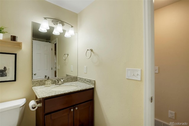 2964 S Akron St, Denver, CO 80231 - bathroom featuring vanity and toilet