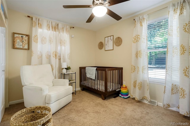 2964 S Akron St, Denver, CO 80231 - carpeted bedroom with a nursery area, multiple windows, and baseboards