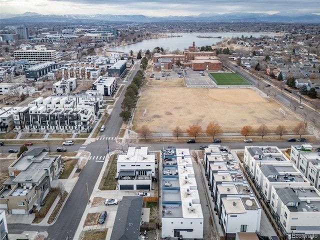 birds eye view of property featuring a water and mountain view