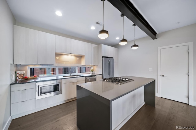 kitchen featuring a kitchen island, appliances with stainless steel finishes, backsplash, beam ceiling, and dark wood-style floors