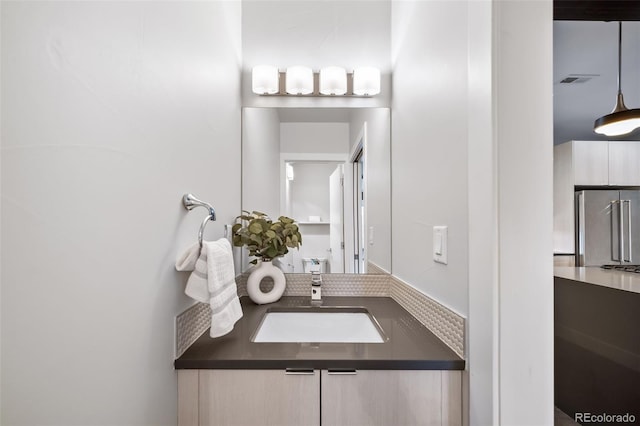 bathroom with visible vents and vanity