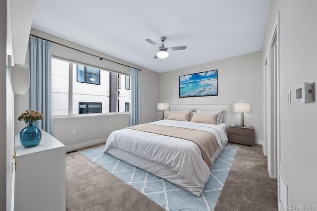 bedroom featuring a ceiling fan, carpet, visible vents, and baseboards