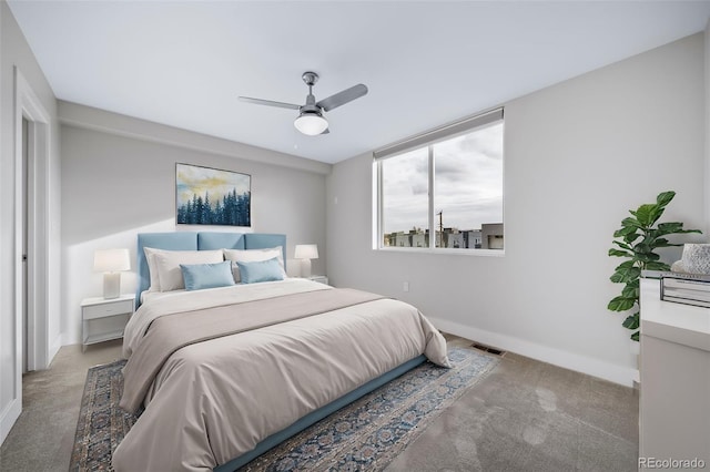 bedroom with a ceiling fan, light carpet, visible vents, and baseboards