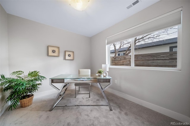 office space with carpet, visible vents, and baseboards