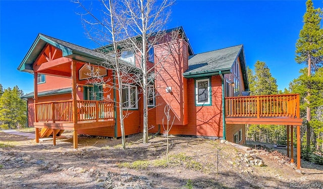 398 Mountain View Dr, Black Hawk, CO 80422 - view of property exterior with a wooden deck and a shingled roof