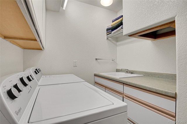 398 Mountain View Dr, Black Hawk, CO 80422 - laundry room featuring washer and dryer, cabinet space, and a textured wall