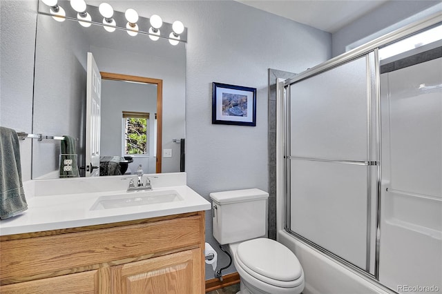 398 Mountain View Dr, Black Hawk, CO 80422 - full bath with vanity, a textured wall, toilet, combined bath / shower with glass door, and ensuite bath