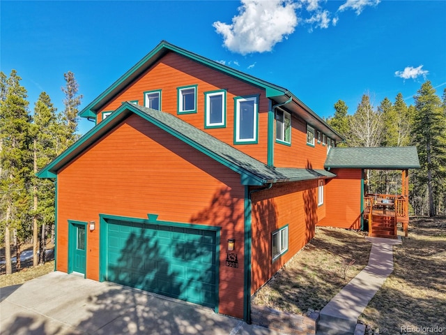 398 Mountain View Dr, Black Hawk, CO 80422 - view of front facade with driveway and a shingled roof