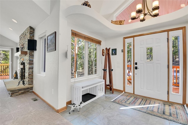 398 Mountain View Dr, Black Hawk, CO 80422 - entryway featuring lofted ceiling, a chandelier, baseboards, a fireplace, and recessed lighting