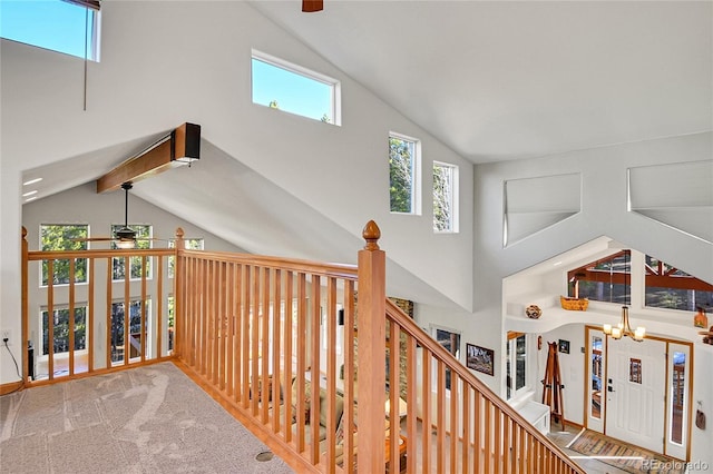 398 Mountain View Dr, Black Hawk, CO 80422 - hall with high vaulted ceiling, a chandelier, and carpet