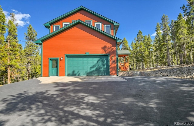 398 Mountain View Dr, Black Hawk, CO 80422 - view of front of home featuring asphalt driveway and a garage