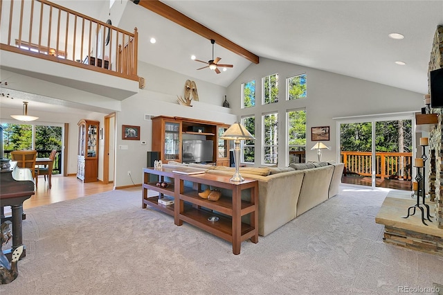 398 Mountain View Dr, Black Hawk, CO 80422 - living area with carpet floors, a ceiling fan, plenty of natural light, beamed ceiling, and high vaulted ceiling