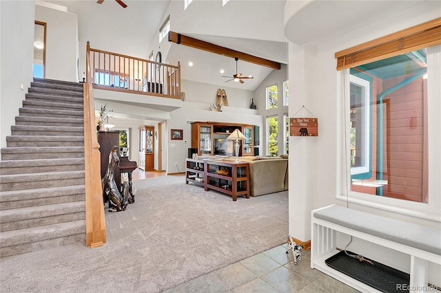 398 Mountain View Dr, Black Hawk, CO 80422 - carpeted entrance foyer featuring ceiling fan, stairway, baseboards, high vaulted ceiling, and beam ceiling