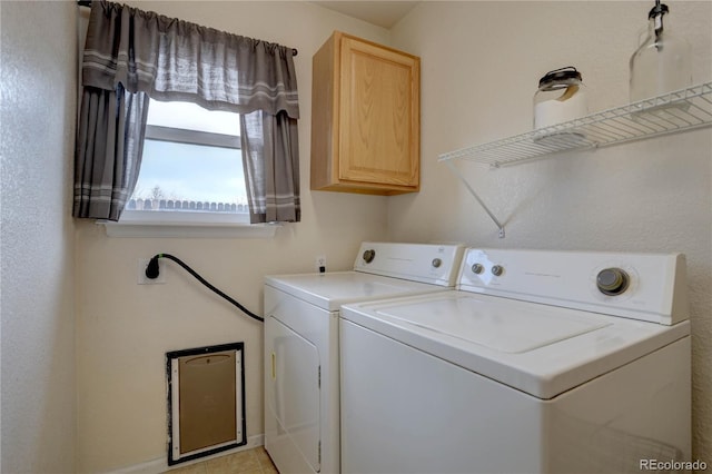 laundry room featuring washer and dryer and cabinet space