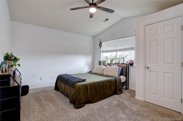 carpeted bedroom with a ceiling fan, visible vents, vaulted ceiling, and baseboards