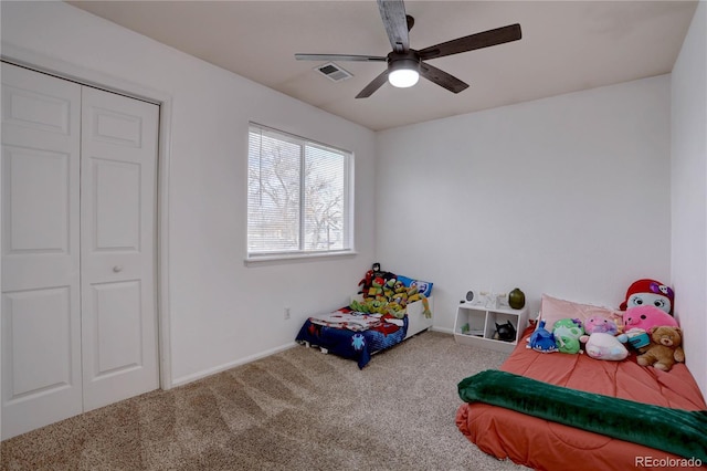 bedroom with carpet, a closet, visible vents, ceiling fan, and baseboards