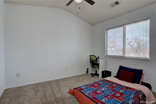 carpeted bedroom featuring a ceiling fan, lofted ceiling, visible vents, and baseboards