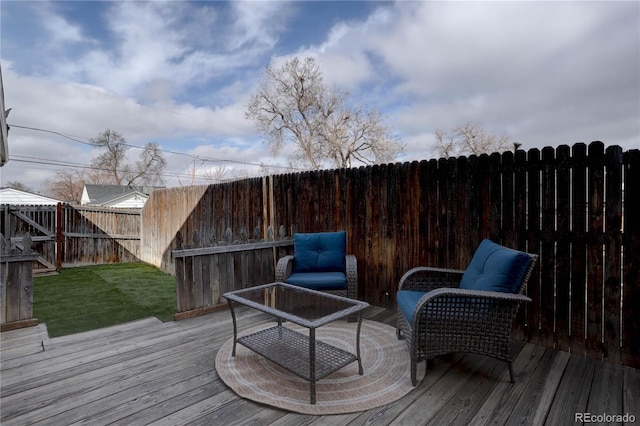 wooden deck with a fenced backyard and a yard