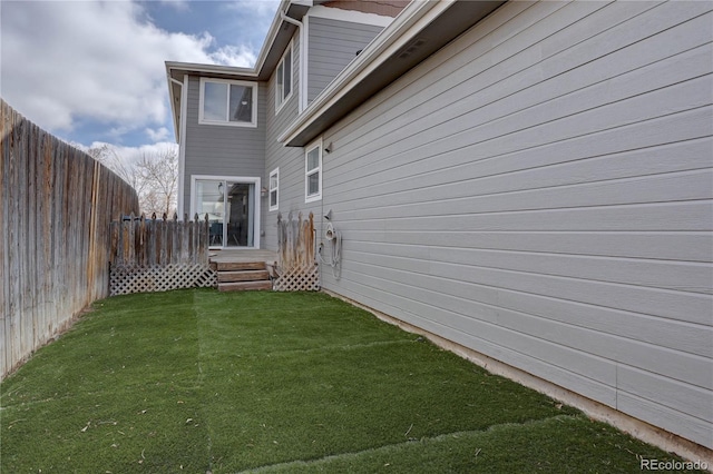 view of yard with a fenced backyard