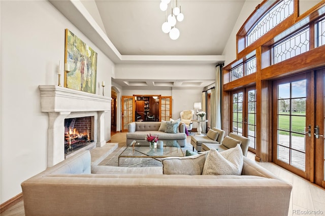 18 Club Ln, Littleton, CO 80123 - living room with french doors, a lit fireplace, and wood finished floors