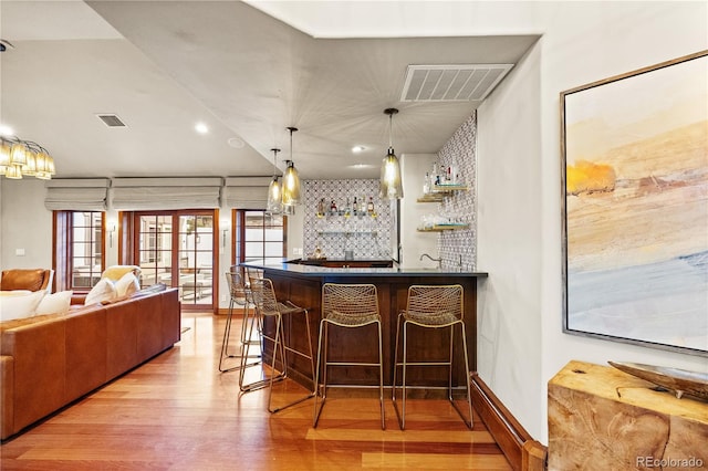 18 Club Ln, Littleton, CO 80123 - bar with wood finished floors, decorative light fixtures, wet bar, visible vents, and recessed lighting
