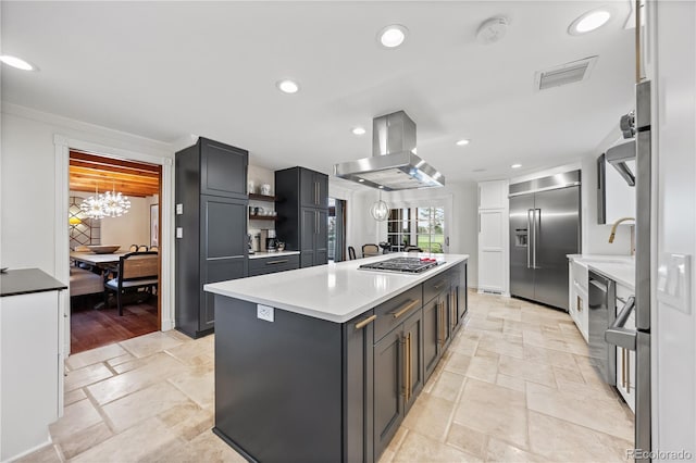 18 Club Ln, Littleton, CO 80123 - kitchen with island exhaust hood, stone tile flooring, open shelves, a center island, and appliances with stainless steel finishes