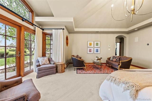 18 Club Ln, Littleton, CO 80123 - bedroom with an inviting chandelier, arched walkways, carpet floors, a tray ceiling, and access to exterior