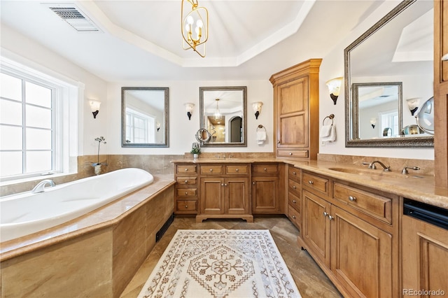 18 Club Ln, Littleton, CO 80123 - full bath with double vanity, an inviting chandelier, a sink, a bath, and visible vents