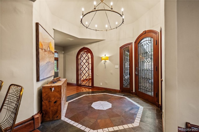 18 Club Ln, Littleton, CO 80123 - foyer entrance with baseboards and a chandelier