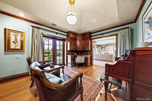 18 Club Ln, Littleton, CO 80123 - living area with french doors, ornamental molding, visible vents, baseboards, and light wood-style floors