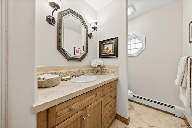 18 Club Ln, Littleton, CO 80123 - bathroom with a baseboard radiator, toilet, baseboards, tile patterned flooring, and vanity