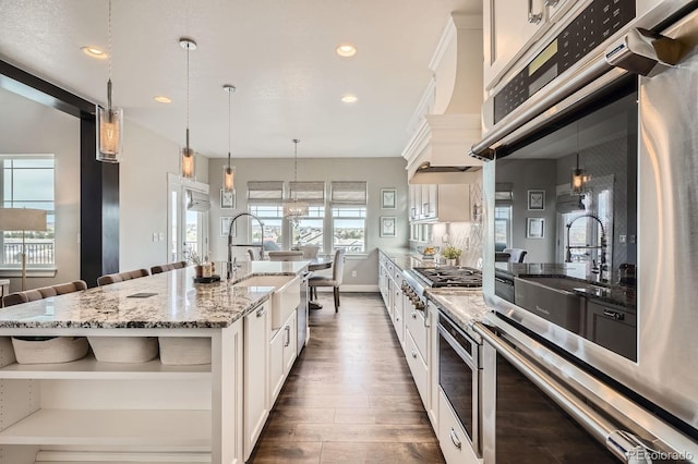 kitchen featuring white cabinets, open shelves, a sink, dark wood finished floors, and recessed lighting