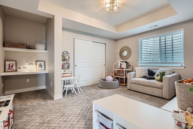 living area featuring visible vents and baseboards