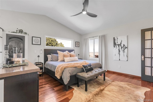 bedroom featuring baseboards, dark wood-style flooring, ceiling fan, and vaulted ceiling