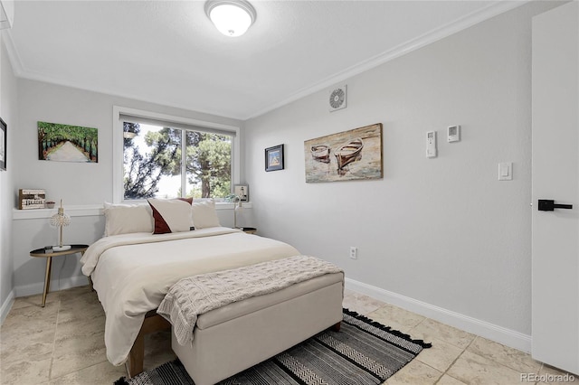 bedroom with baseboards and crown molding